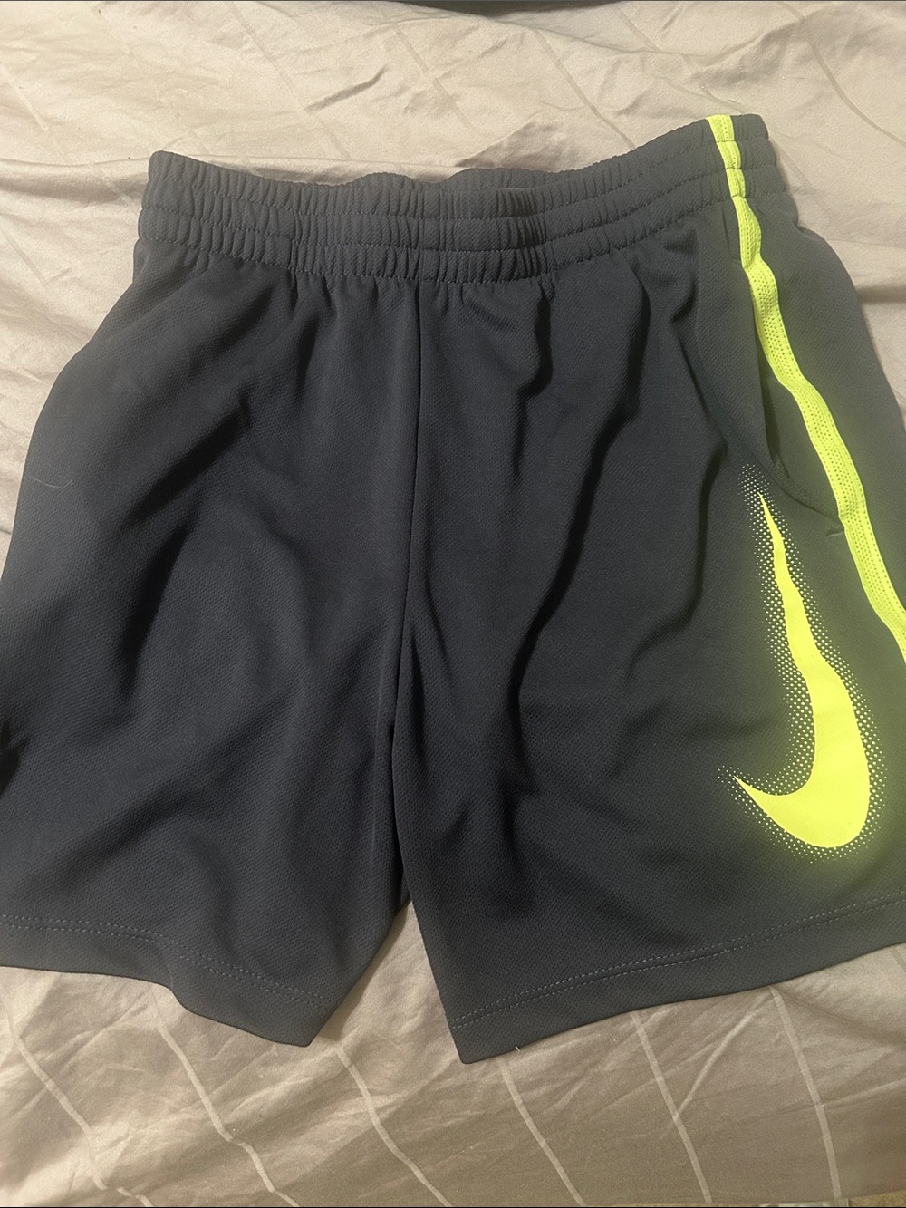 Nike Black Shorts with Neon Yellow Swoosh Accent